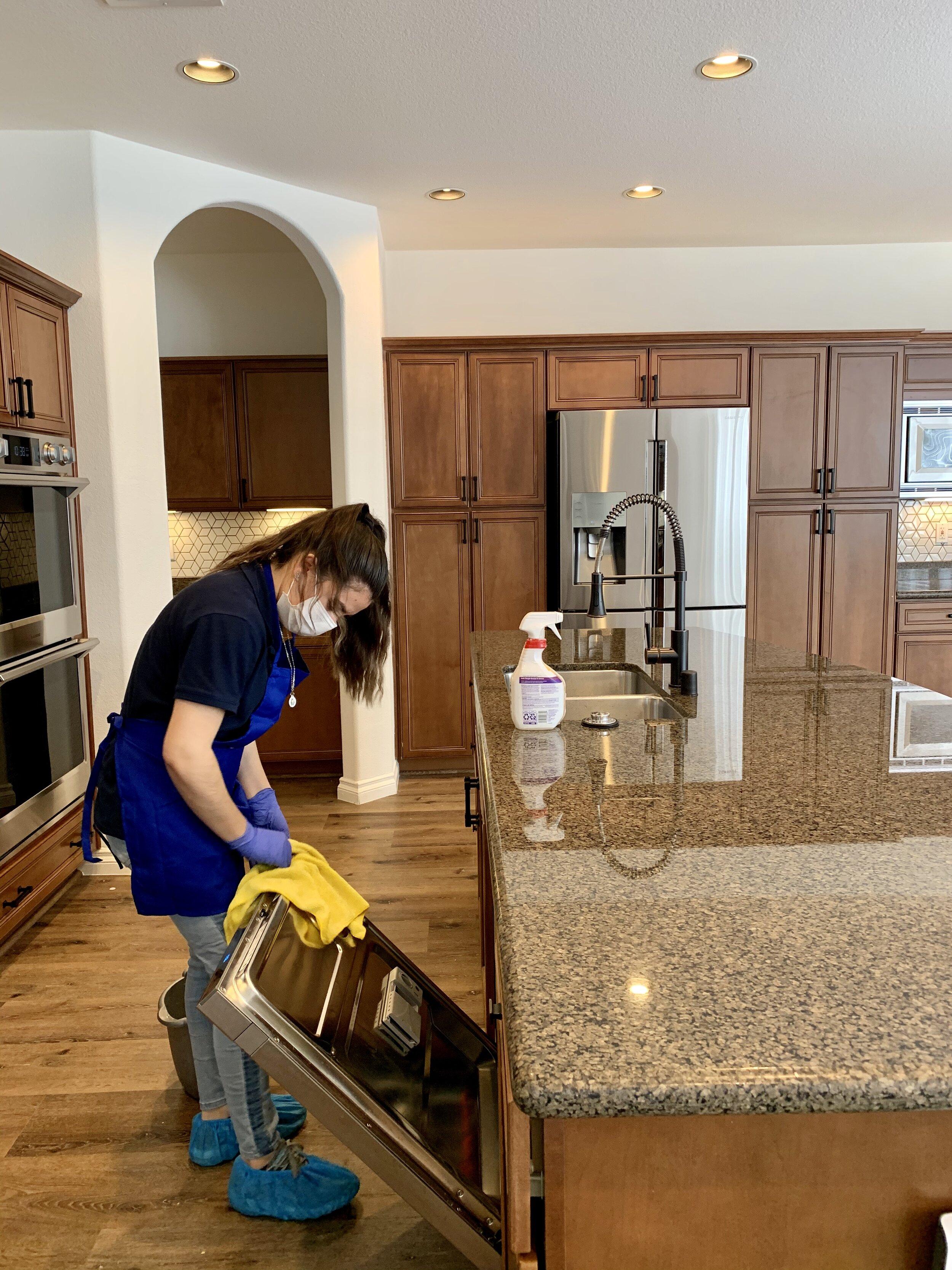 Female Cleaning Kitchen